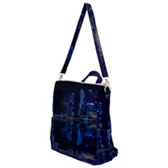 Illuminated Cityscape Against Blue Sky At Night Crossbody Backpack by Modalart